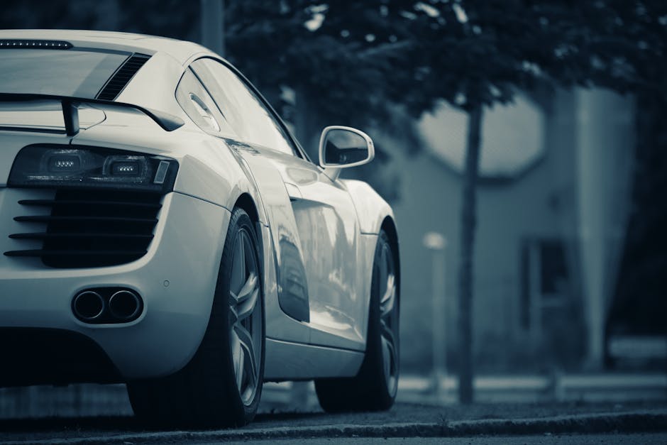 Luxury Cars - A luxury white sports car parked on a street in #13148546