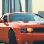 Luxury Cars - Dynamic shot of an orange sports car with Dubai #13916693