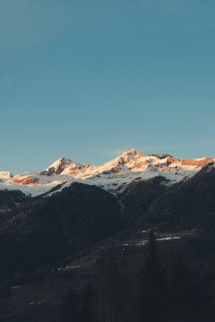 Mountain Landscapes - Beautiful sunset over snow capped Dolomites in T #15021365