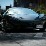 Luxury Cars - Sleek black sports car positioned prominently on #16595082