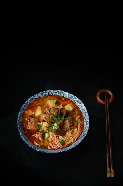 Food Aesthetics - Close-up of a flavorful beef ramen noodle dish w #1907244