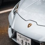 Luxury Cars - Detailed view of a silver Lamborghini's front bu #23124136