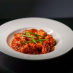 Food Aesthetics - Spicy Indian paneer tikka served in a rich tomat #28674541