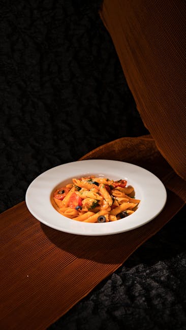 Food Aesthetics - A vibrant Italian pasta dish garnished with herb #31261502