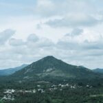 Mountain Landscapes - Lush green hills under a cloudy sky in Bengaluru #34271583