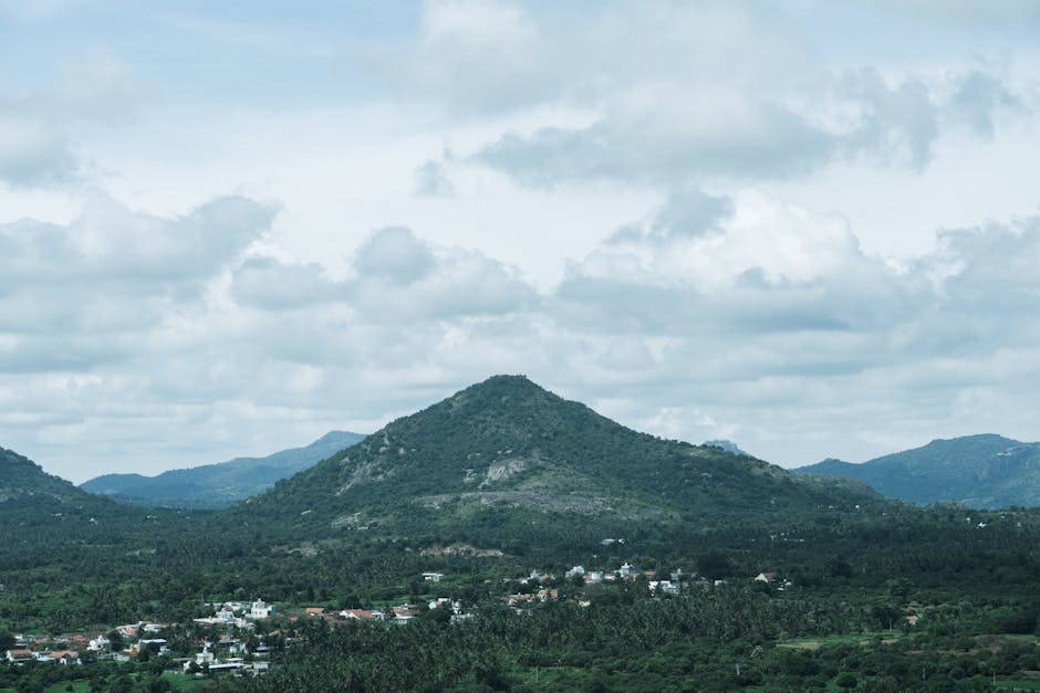 Mountain Landscapes - Lush green hills under a cloudy sky in Bengaluru #34271583