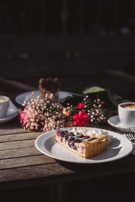 Food Aesthetics - Delicious berry tart with cream served alongside #35121850