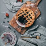Food Aesthetics - Homemade blueberry pie on wooden board with fres #5107183