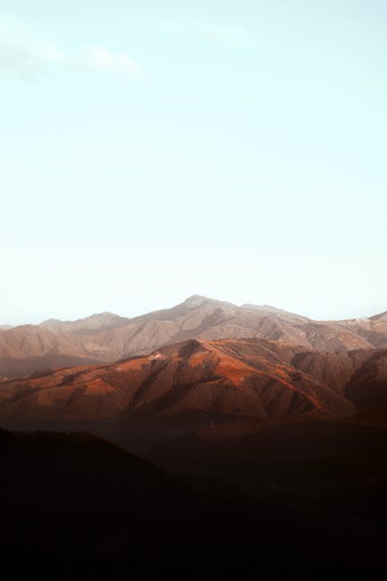 Mountain Landscapes - Captivating view of a mountain range at sunrise #7412553