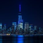 City Architecture - Illuminated New York City skyline reflecting ove #747101
