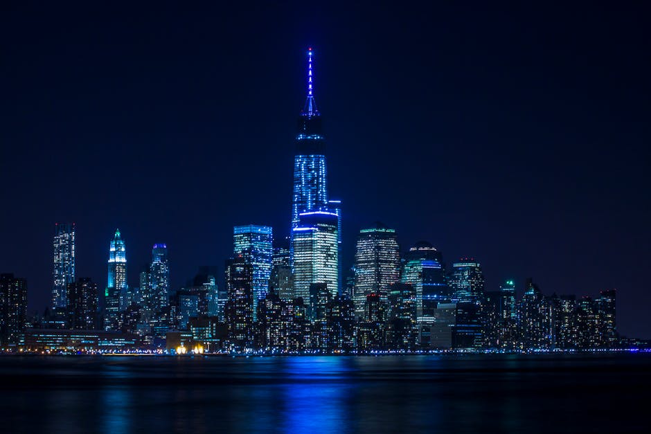 City Architecture - Illuminated New York City skyline reflecting ove #747101